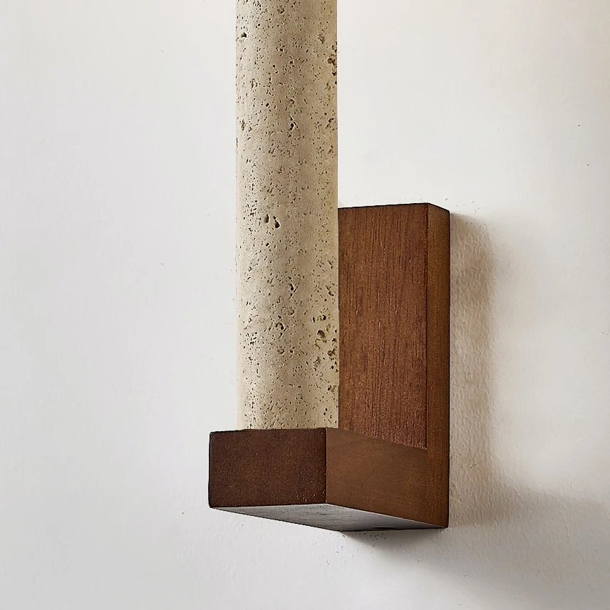 Natural travertine and wood wall sconce viewed from the side